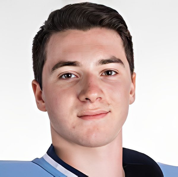 Close-up of young man in light-blue jersey