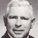 Grayscale headshot of an older man
