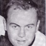 Black-and-white headshot of a young man