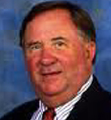 Headshot of middle-aged man in suit and tie