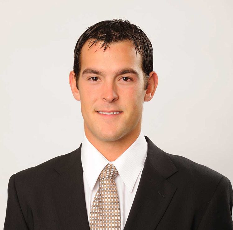 Smiling professional in suit and tie