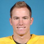 Smiling young man wearing yellow sports jersey