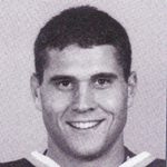 Smiling young man wearing sports jersey