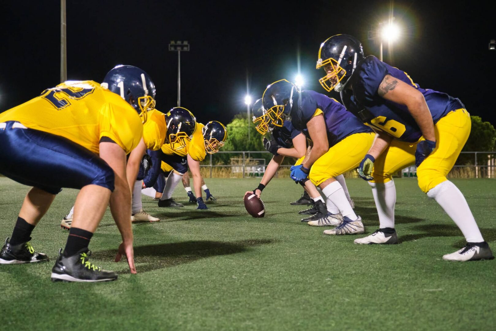 American football players at line of scrimmage