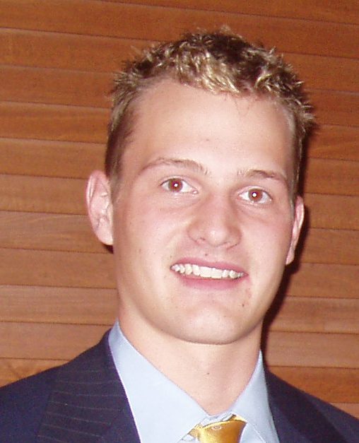 Smiling young man in suit and tie