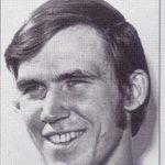 Smiling young man portrait, black and white