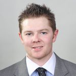Smiling young man wearing suit and tie