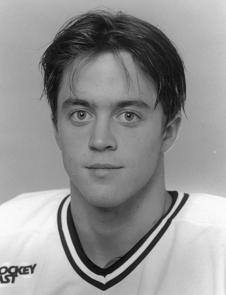 Black-and-white portrait of young man in jersey