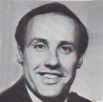 Black-and-white portrait of a smiling man