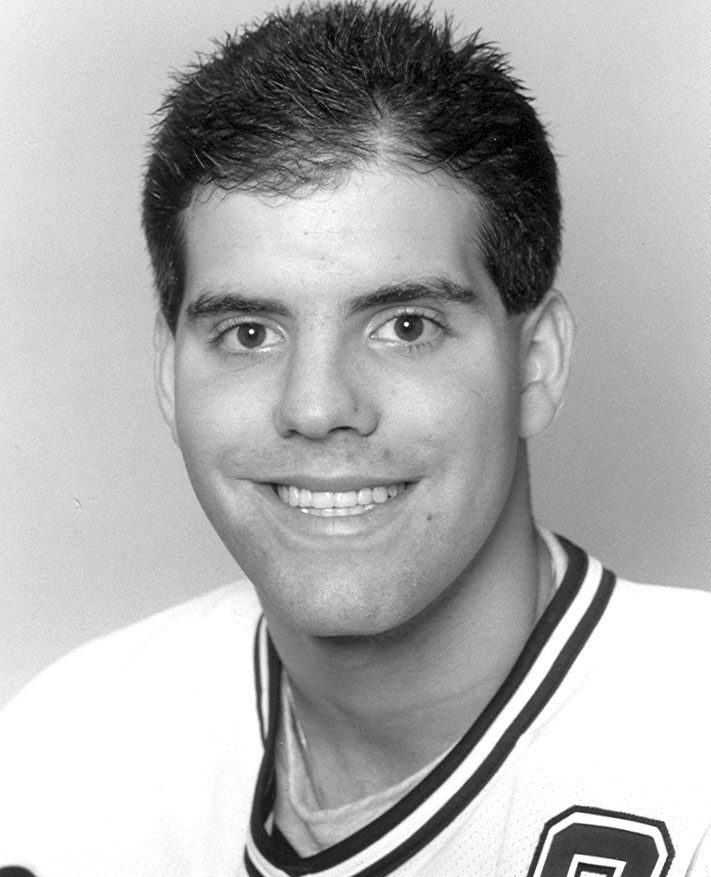 Smiling young man wearing a sports jersey
