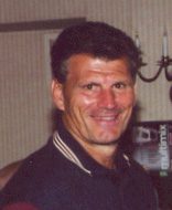 Smiling middle-aged man indoors