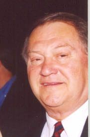 Smiling man wearing a suit and tie