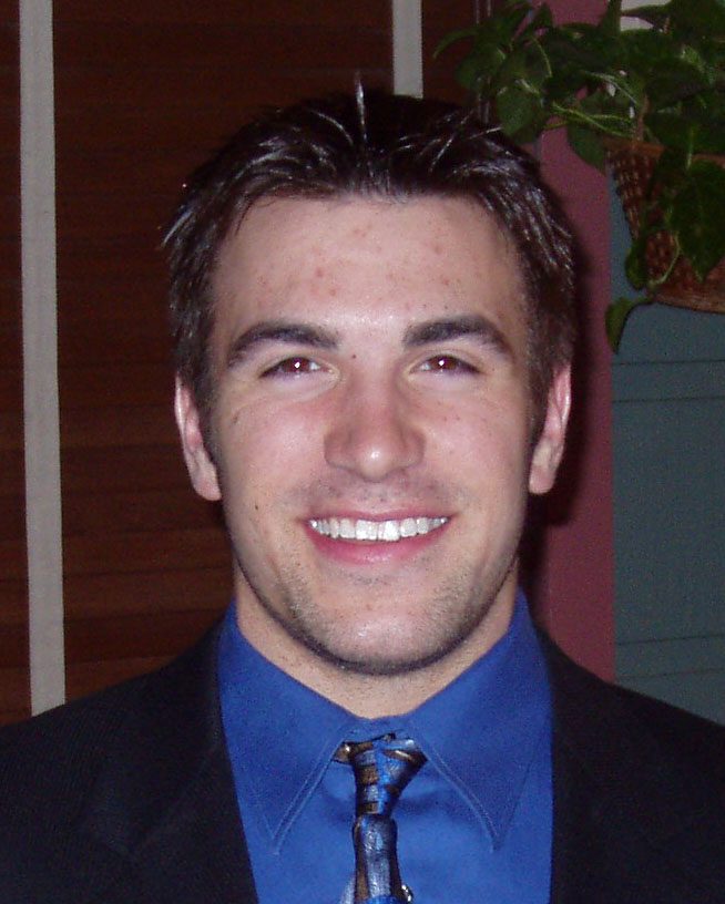 Smiling young man wearing suit and tie