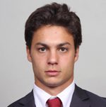 Professional headshot of person in suit and tie