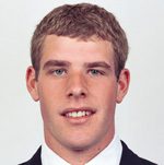 Headshot of young man in suit and tie