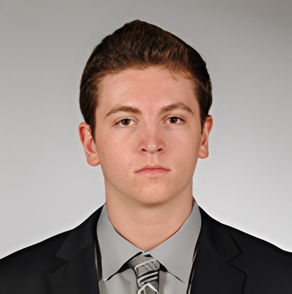 Headshot of young man in suit