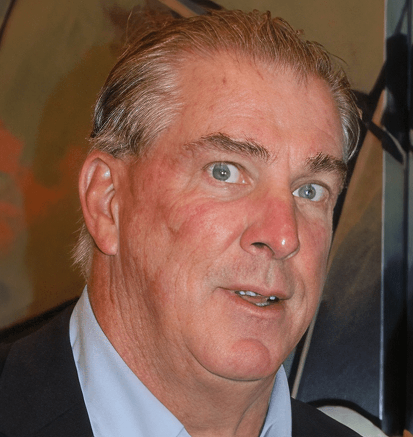 Close-up of gray-haired man in suit