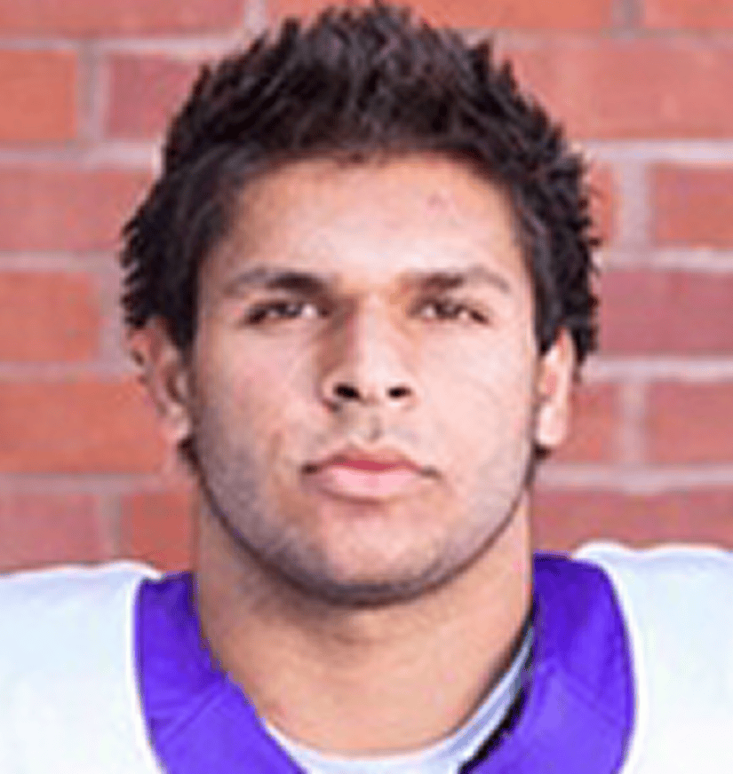 Athlete in purple and white football jersey