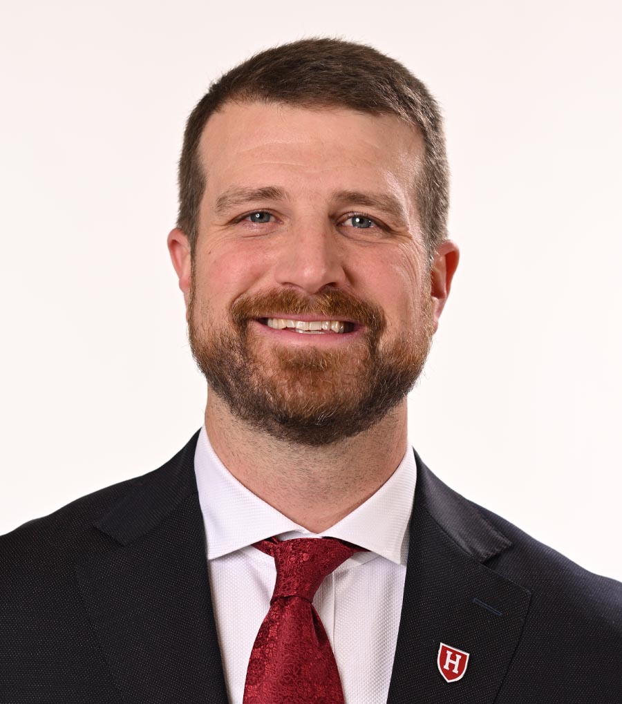 Smiling bearded man in suit and tie