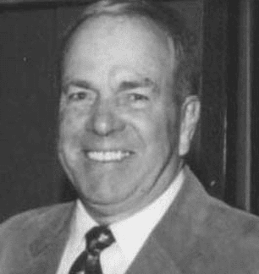 Black-and-white portrait of smiling man