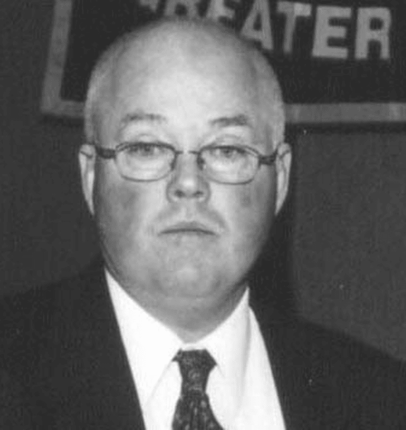 Portrait of man in suit and glasses