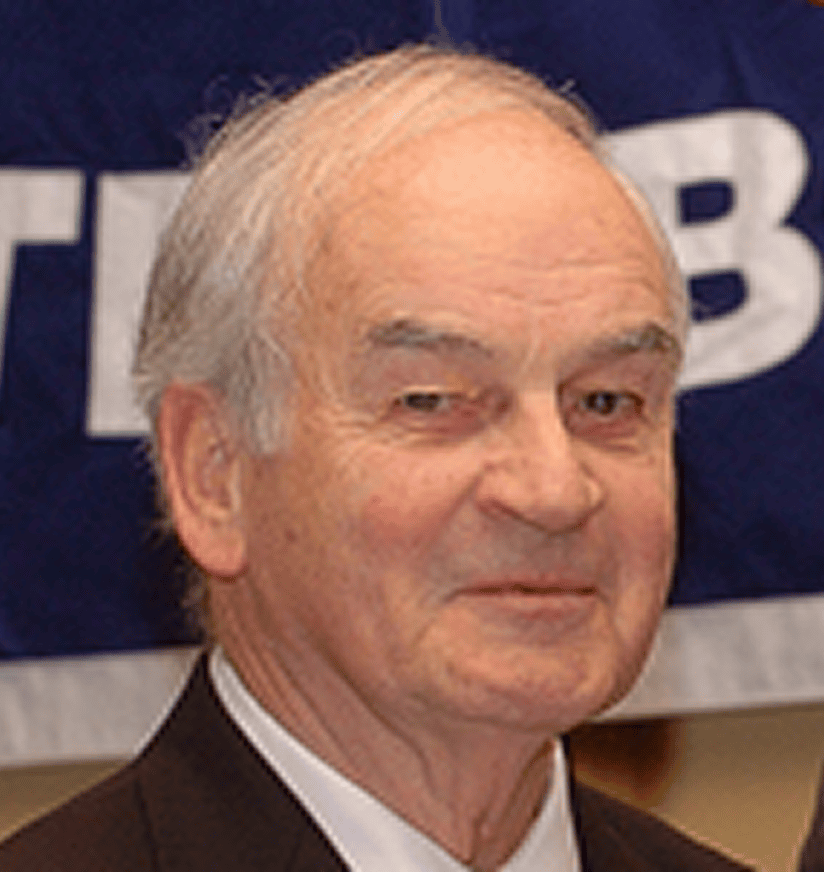 Smiling older man at indoor event
