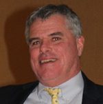 Smiling middle-aged man in suit and tie