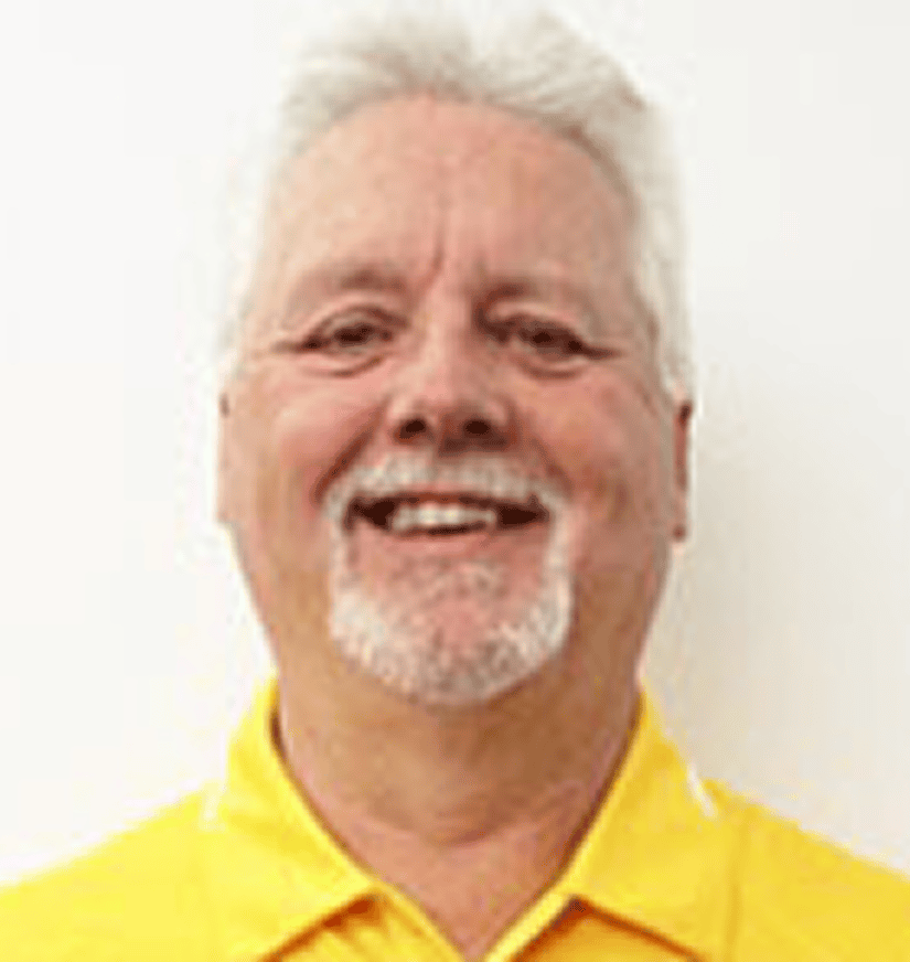 Smiling person with white hair, yellow shirt