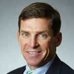 Headshot of smiling man in business suit
