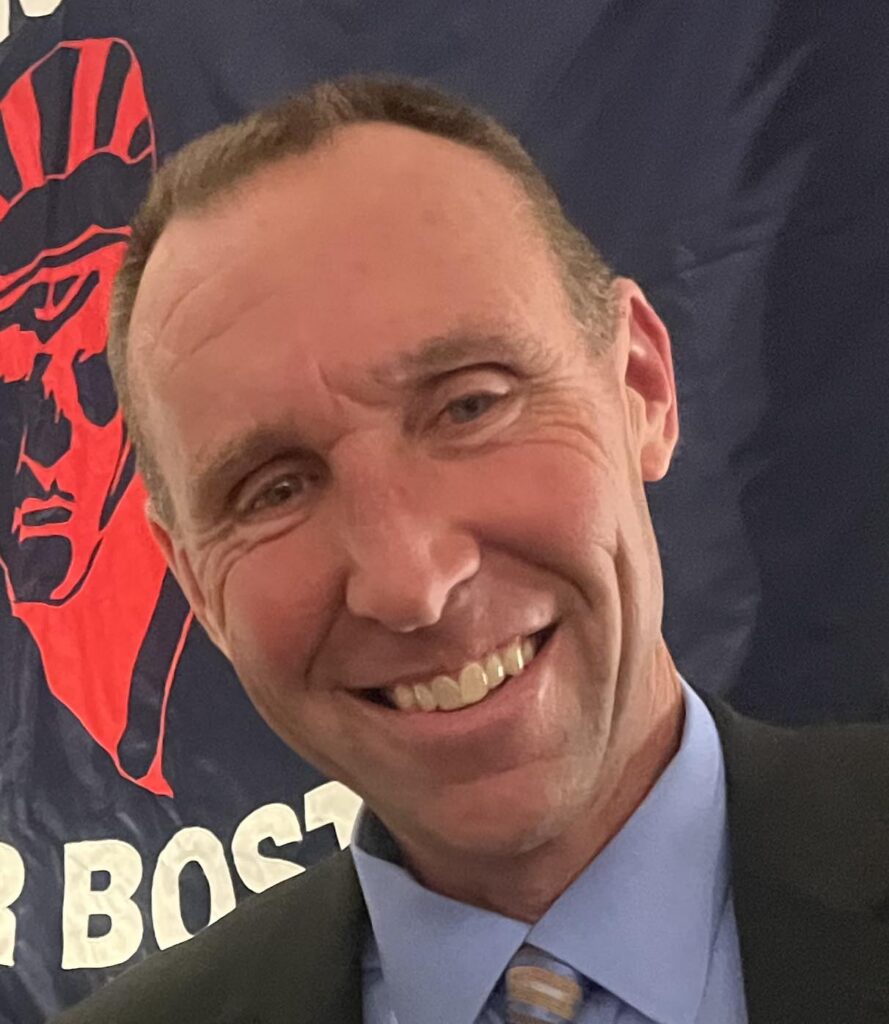 Smiling man in suit and tie, banner background