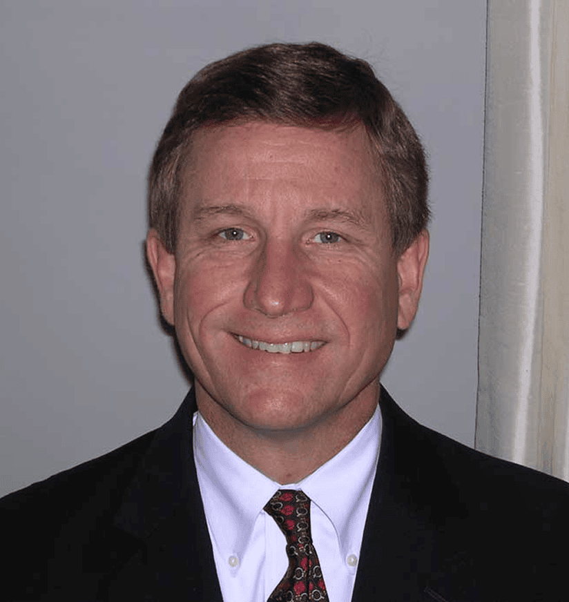 Smiling man in suit and patterned tie