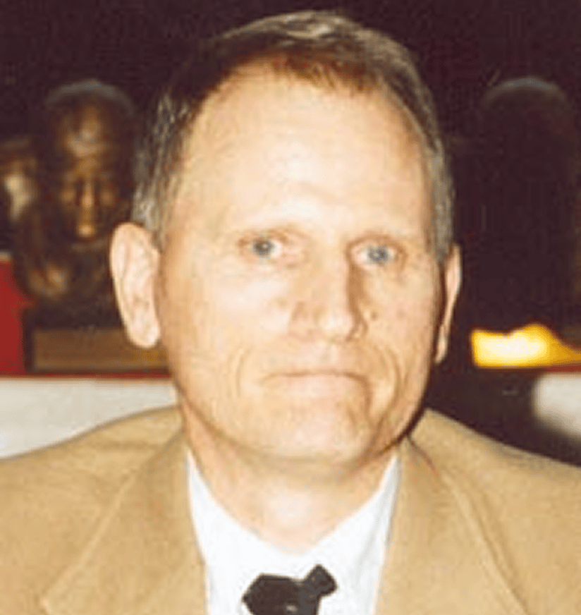 Portrait of man wearing tan suit jacket
