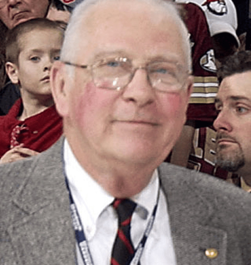 Smiling elderly man in suit and tie