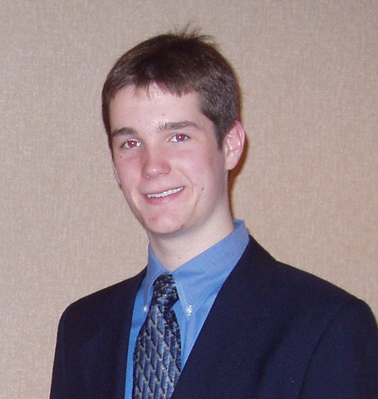 Smiling young man in suit and tie