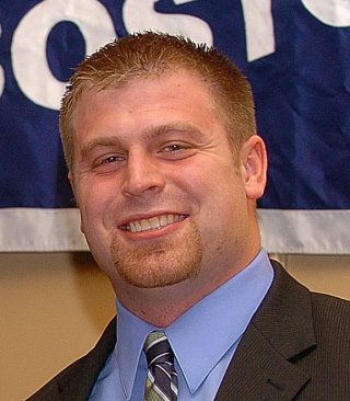 Smiling man wearing suit and tie