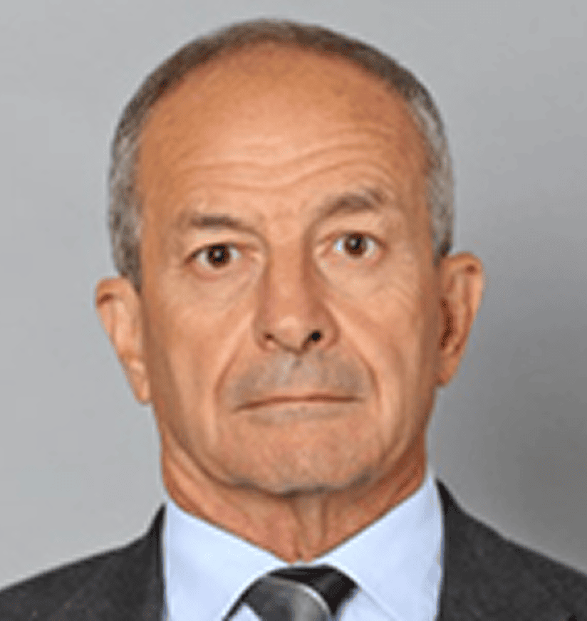 Headshot of older man in suit