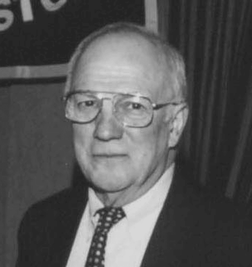 Black-and-white portrait of older man in suit