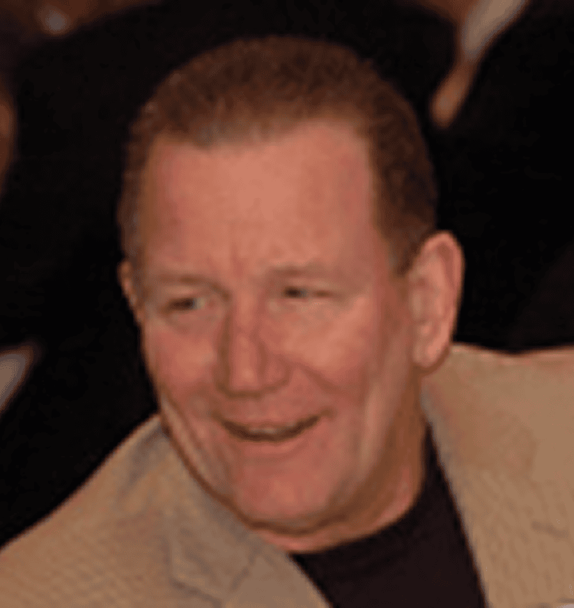 Smiling middle-aged man in beige jacket