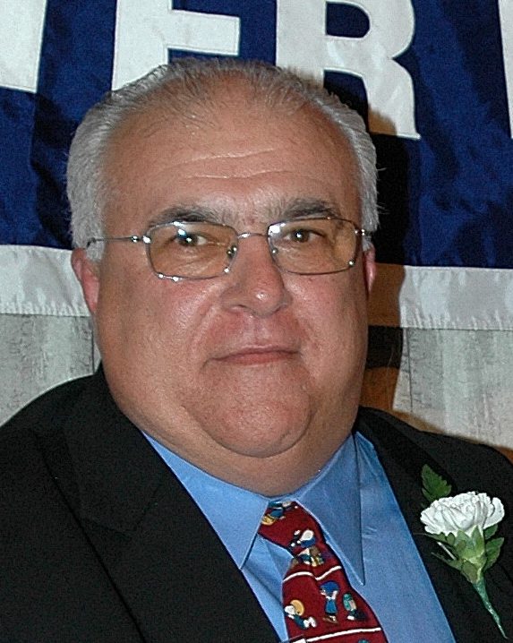 Older man in suit with boutonniere