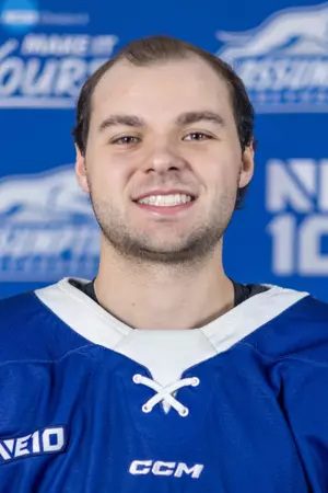 Smiling hockey player in blue jersey
