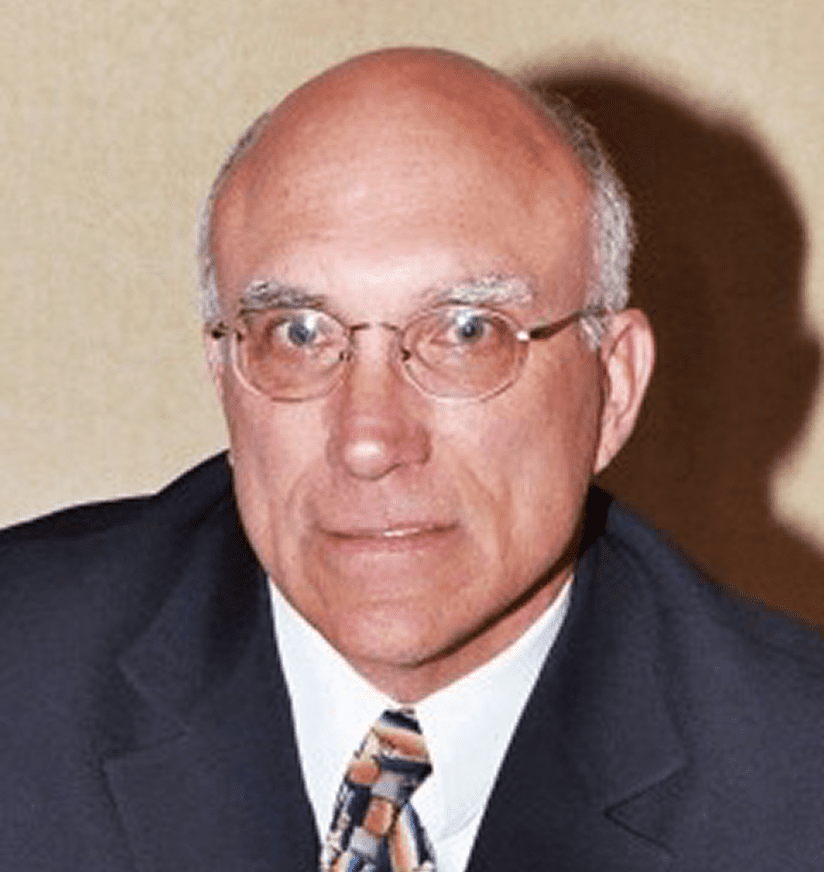 Portrait of man in suit and glasses