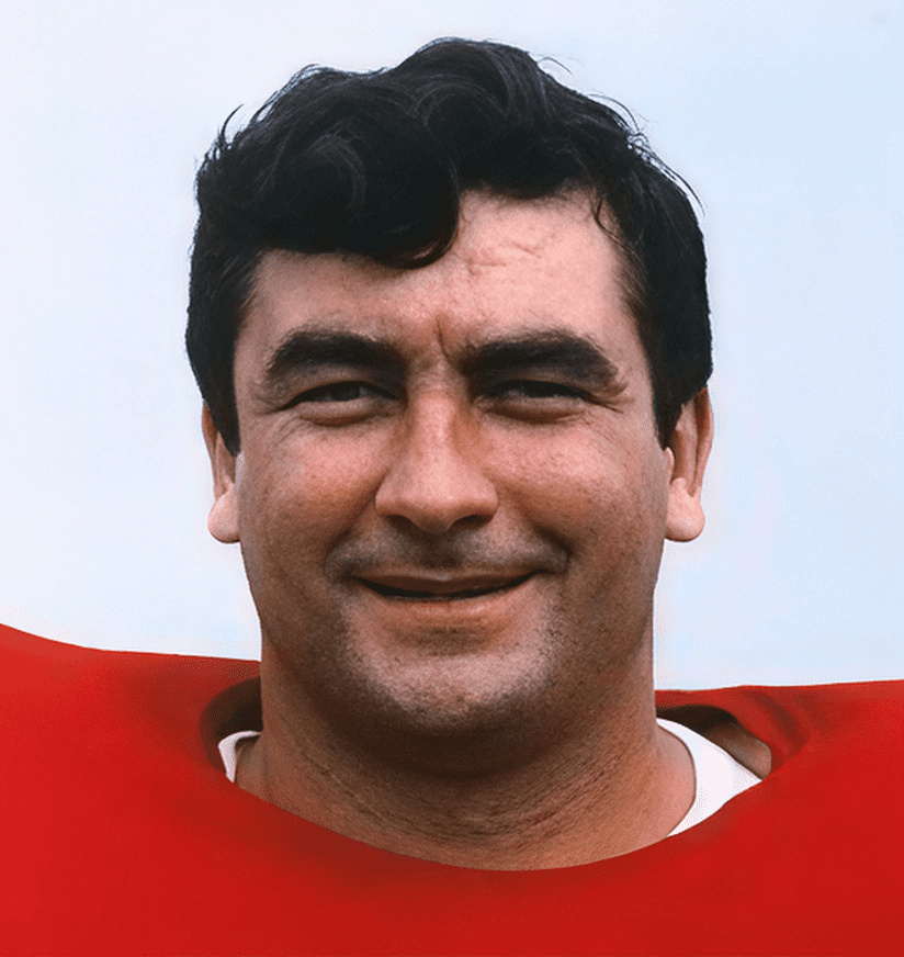 Smiling man wearing red football jersey