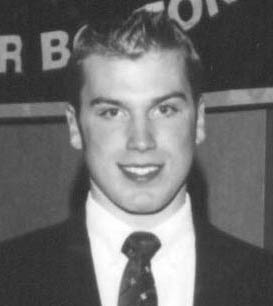 Smiling young man in suit and tie
