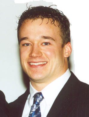 Smiling young man in suit and tie