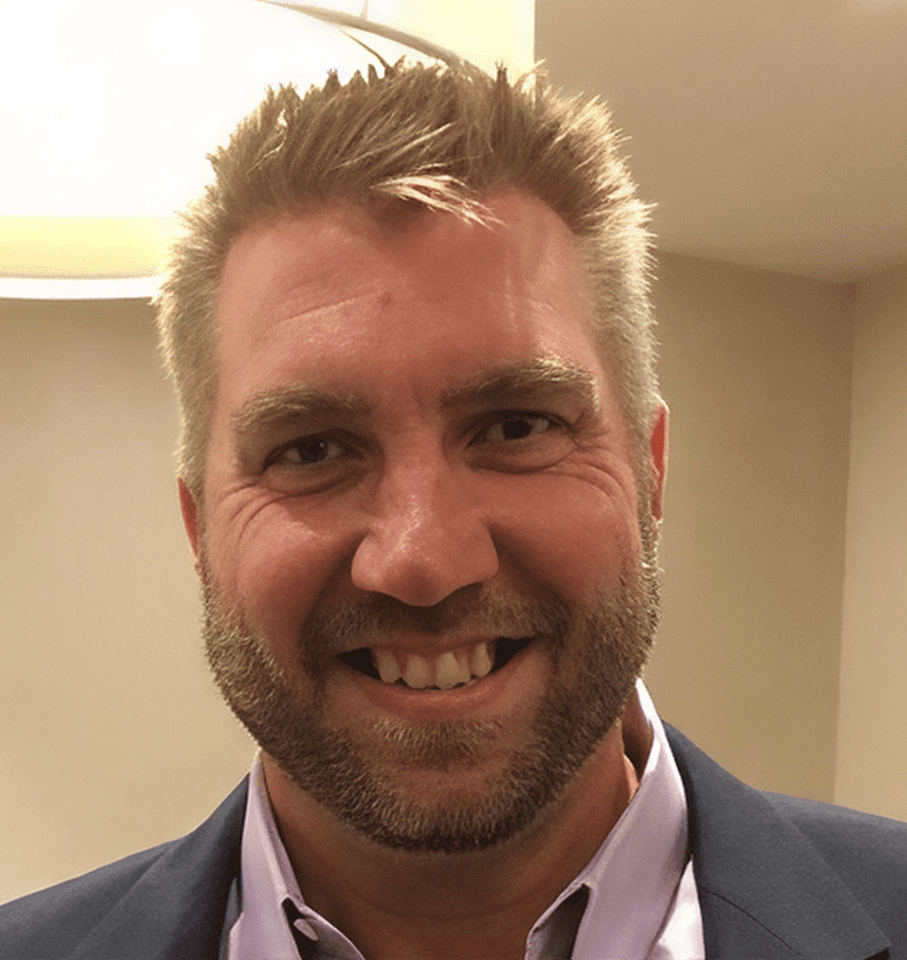 Smiling bearded man in blazer