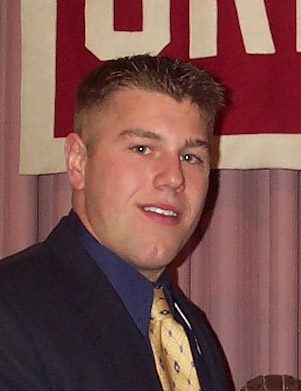 Smiling young man in suit and tie