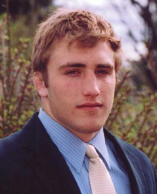 Young man in suit and tie outdoors