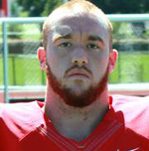 Close-up bearded football player in red jersey
