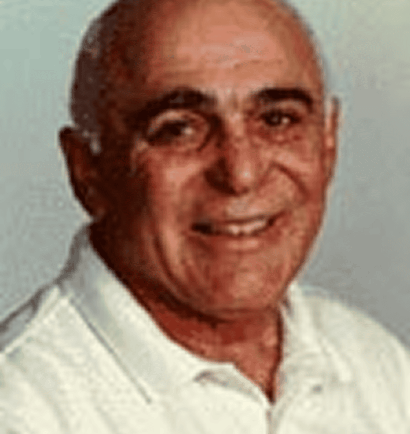 Smiling bald man wearing white collared shirt