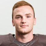 Young man in football jersey